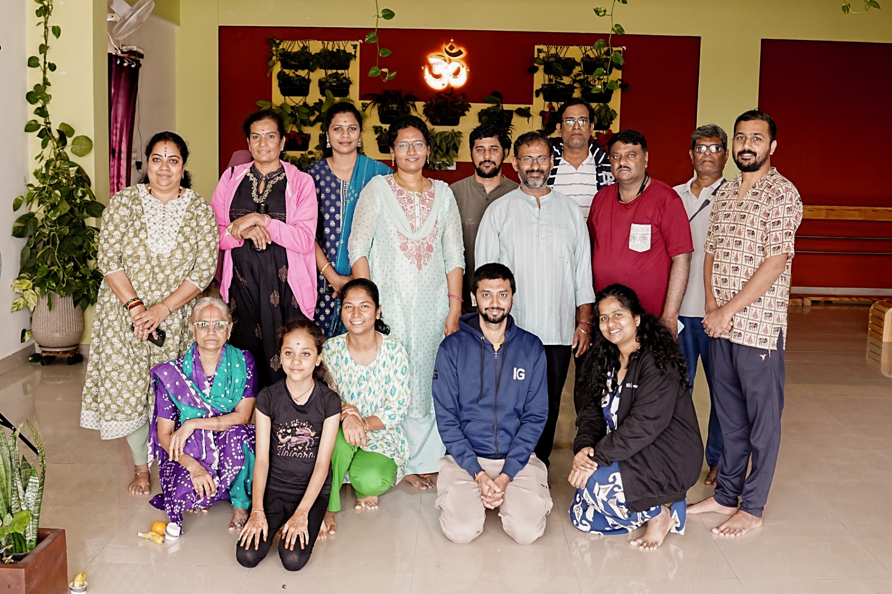 A group photograph of students and teachers at Guru Paduka Yoga