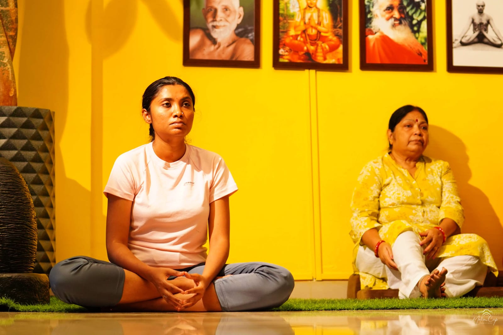 Students seated together in stillness during a shared practice